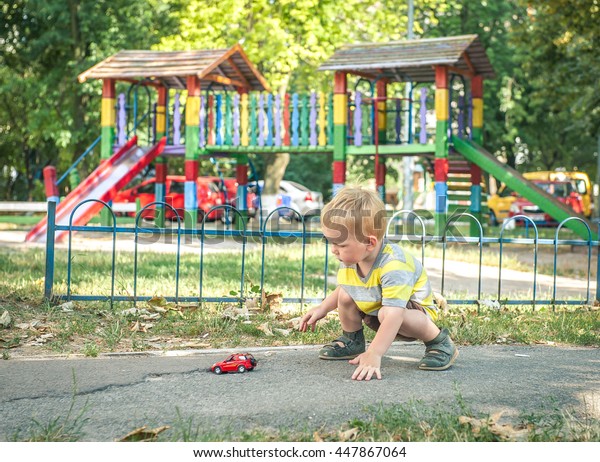 Little Boy Plays Toy Car Adorable Stock Photo Edit Now 447867064