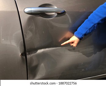 Little Boy Pointing Finger At Damaged Car Door, Scratched Car