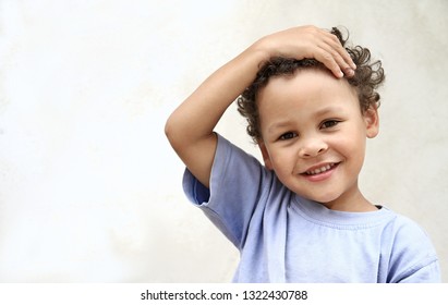 little boy posing in front of the camera