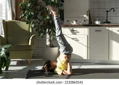 Little boy practicing yoga, stretching, fitness at home. Distant online education training, aerobic at home. Healthy lifestyle, coronavirus, stay home. Kids sport home quarantine.