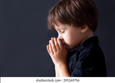 Little Boy Praying, Child Praying, Isolated Black Background