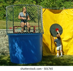 Little Boy Pressing Dunk Tank Button