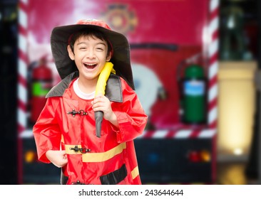 Little boy pretend as a fire fighter