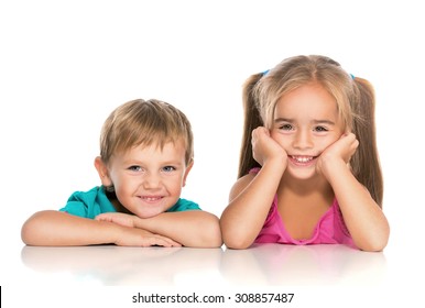 Little boy and pretty girl smiling on a white background