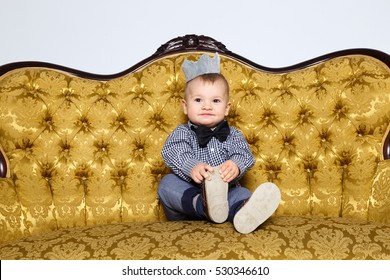 little boy prince with crown , success, heir happy childhood  sitting on yellow. Image of sweet baby boy, portrait of child, cute toddler. luxurious interior in the castle happy childhood - Shutterstock ID 530346610