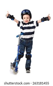 Little Boy In Protection Helmet And In The Knee And Arm Ruffles Riding His Scooter