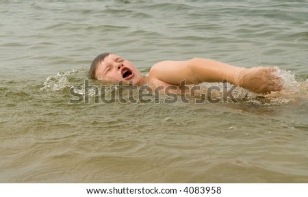 Similar – One happy little boy playing on the beach