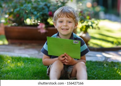 Little Boy Reading His First Letter From A Friend