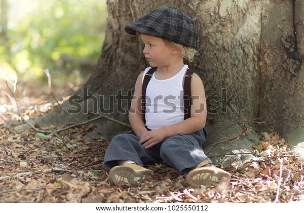 Little Boy Resting Against Tree Woods Stock Photo (Edit Now) 1025550112