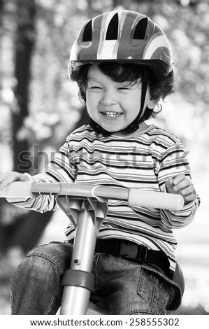 Similar – A funny boy riding his bicycle