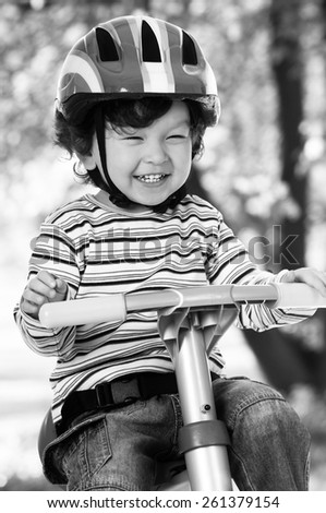 Similar – A funny boy riding his bicycle