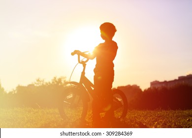 Little Boy Riding Bike At Sunset, Active Kids Sport