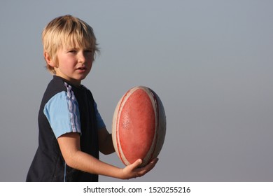 little boy with rugby ball