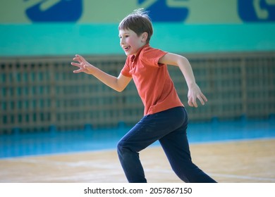 Little Boy Runs In The Gym.