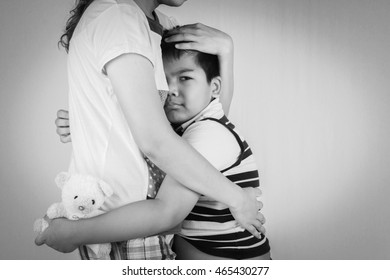 Little Boy Sad In  Hugging Of  Mother 