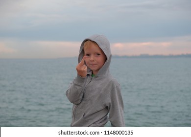 Little Boy Showing Middle Finger. The Child Showed The Middle Finger