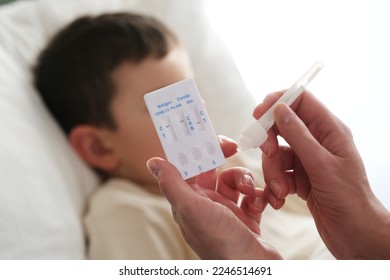 A little boy is sick, a combo antigen test (covid-19, flu a b, RSV) is needed for proper diagnosis. - Shutterstock ID 2246514691