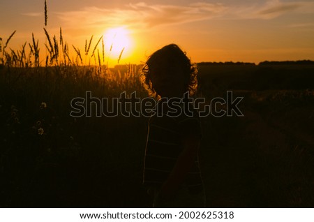 Similar – Image, Stock Photo Young woman looking at the sunset.