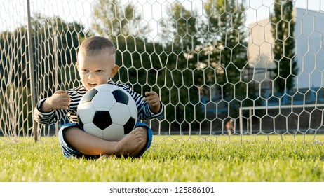 Little Boy Sitting Cross Legged On Stock Photo 125886101 | Shutterstock