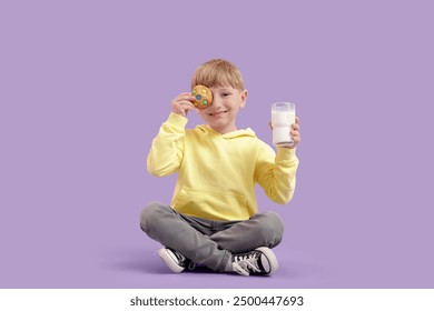 Little boy sitting with glass of milk and cookie on lilac background - Powered by Shutterstock