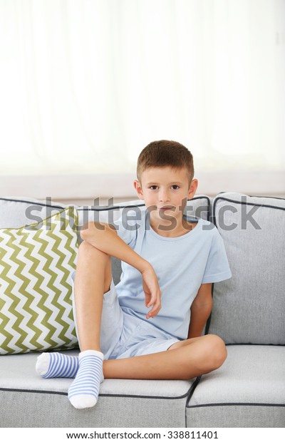 Little Boy Sitting On Sofa On Stock Photo 338811401 | Shutterstock