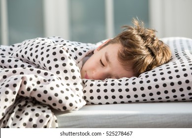 Little Boy Sleeping In Bed
