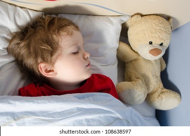 Little Boy Sleeping In His Bed