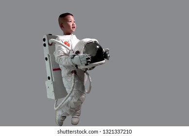 Little Boy In Space Suit. Kids Dream Jobs Diversity Occupations. 
Astronaut Boy Stand.
Kid In Space Suit.
Astronaut Boy Smile.
Astronaut Boy Looking At The Sky.