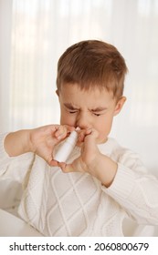 Little Boy Spraying Medicine In Nose, Nose Drops. Toddler Child Using Nasal Spray. Runny Nose, Cold, Flu, Illness, Virus. Close Up.