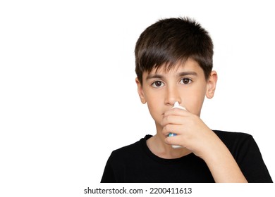 Little Boy Spraying Medicine In Nose, Nose Drops. Little Child Using Nasal Spray. Runny Nose, Cold, Flu, Illness, Virus. Close Up. Isolated On The White Background