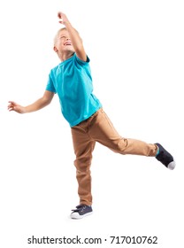 LITTLE BOY STANDING ON ONE LEG ISOLATED ON WHITE BACKGROUND