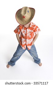 Little Boy With A Straw Sherrif Hat Looking Down At White Background