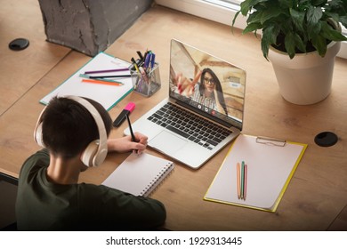 Little boy studying by group video call, use video conference with teacher, listening to online course. Using stationery, notebook. Easy, comfortable usage concept, education, online, childhood. - Powered by Shutterstock