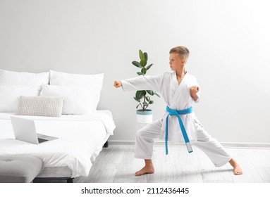 Little Boy Studying Karate Online At Home