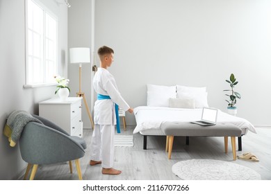 Little Boy Studying Karate Online At Home