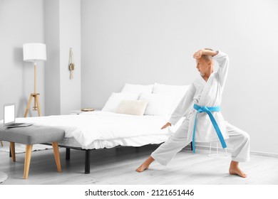 Little Boy Studying Karate Online At Home