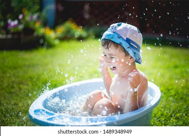 Little Boy Taking Bath Outside