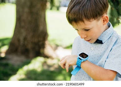 Little boy talking on smart watch with mother. Smartwatch for baby safety. child learning new technology. Mother and son talking to each other through video call on smartwatch. - Powered by Shutterstock