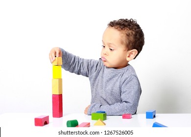 Little Boy Testing His Creativity By Building Towers With Toy Building Blocks No People Stock Photo