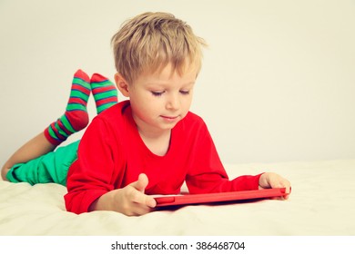 Little boy with touch pad, early education