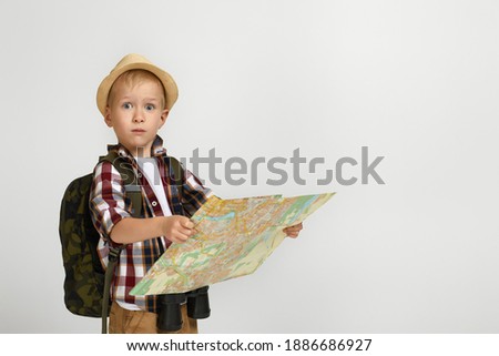 Similar – Image, Stock Photo boy with hat and map on blue background