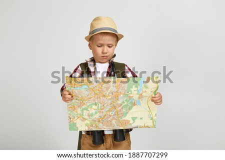 Similar – Image, Stock Photo boy with hat and map on blue background