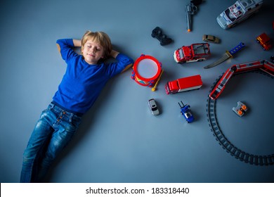 Little Boy With Toys In Studio