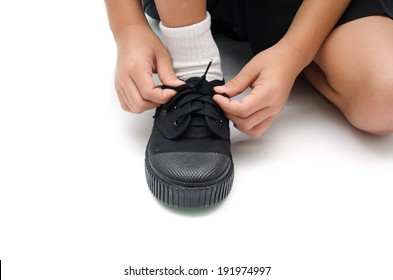 Little Boy Tying Shoes Close Up