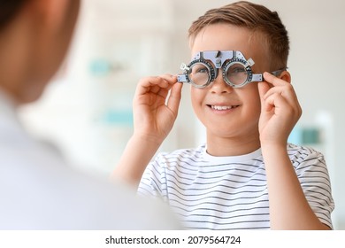 Little boy undergoing eye test in clinic - Powered by Shutterstock