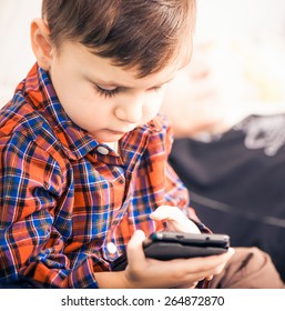 Little Boy Using Android Touch Screen Phone