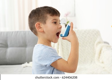 Little boy using asthma inhaler at home - Powered by Shutterstock