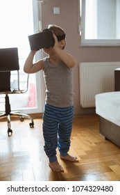 Little Boy Using VR Headset In The Livingroom