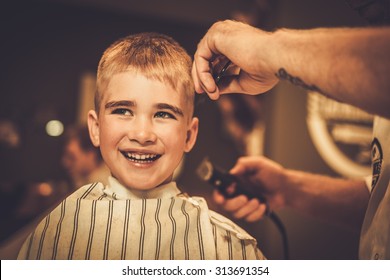 Little Boy Visiting Hairstylist In Barber Shop