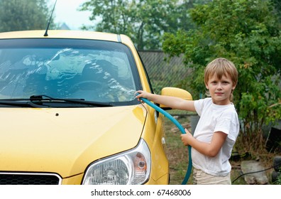 Little Boy Washing Car